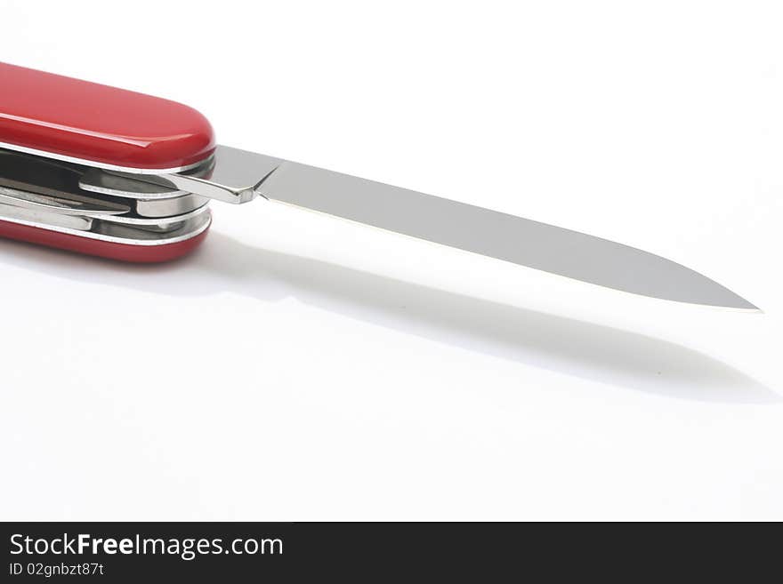 A red swiss army knife isolated on white