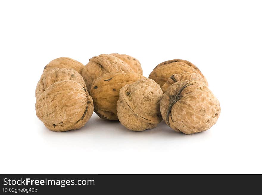 Small group of walnuts. Isolated on white background.