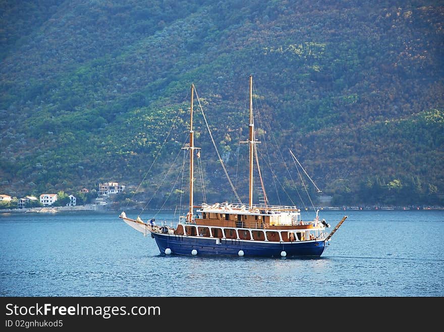 Sail ship on blue calm sea