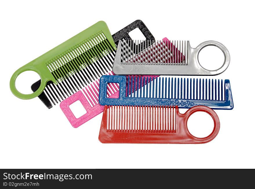 Multi-coloured hairbrushes on a white background