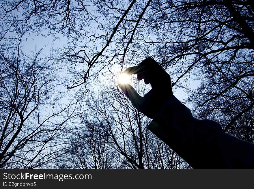 Conception of hand and sun image. Sun in fingers.