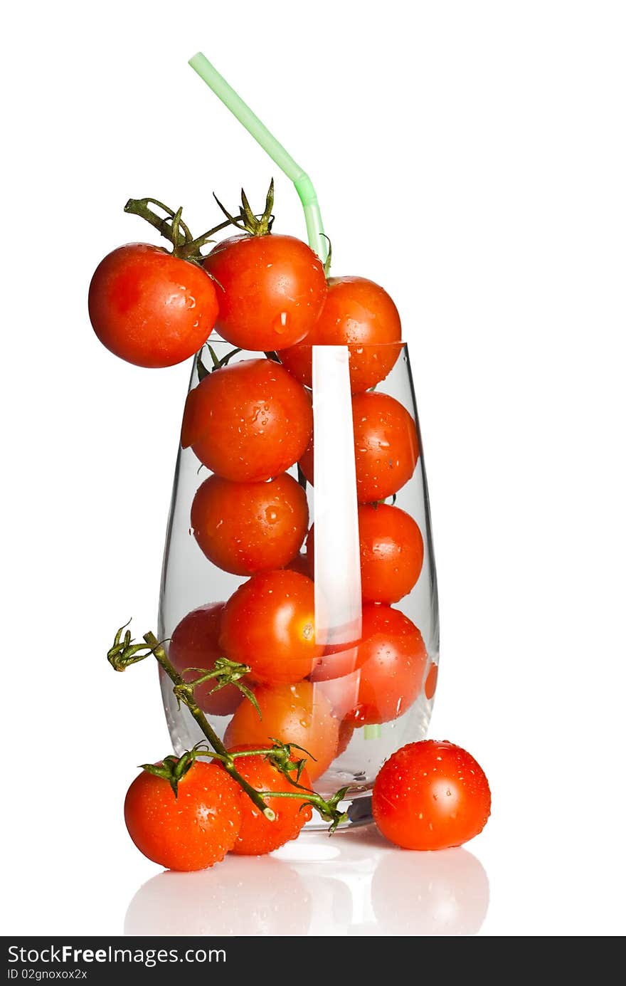 Bunch of tomatoes in a glass with straw. Bunch of tomatoes in a glass with straw