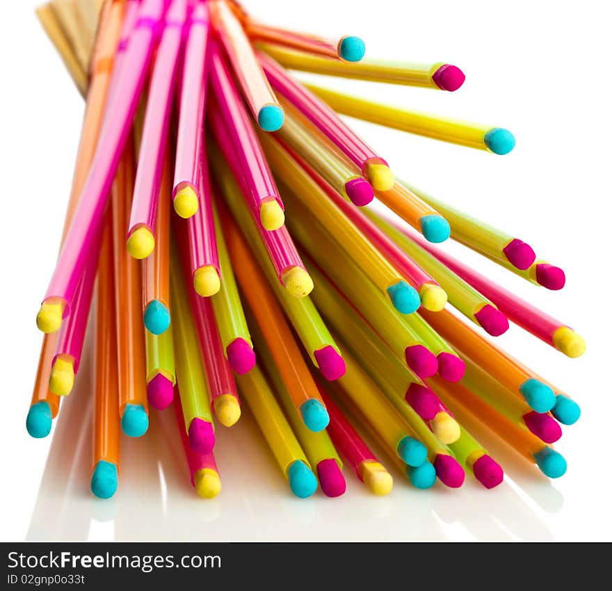 Pile of colorful matches, reflected from the white surface. Pile of colorful matches, reflected from the white surface