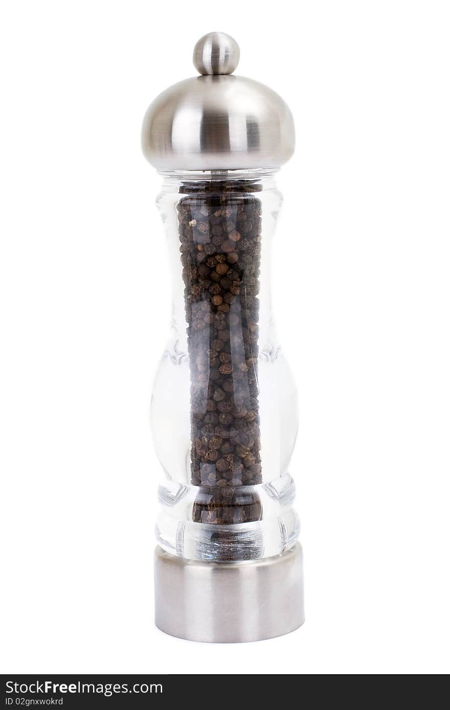 A series. A glass grinder of pepper isolated on a white background