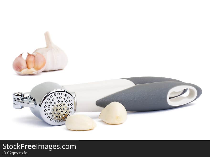 Garlic press isolated on white