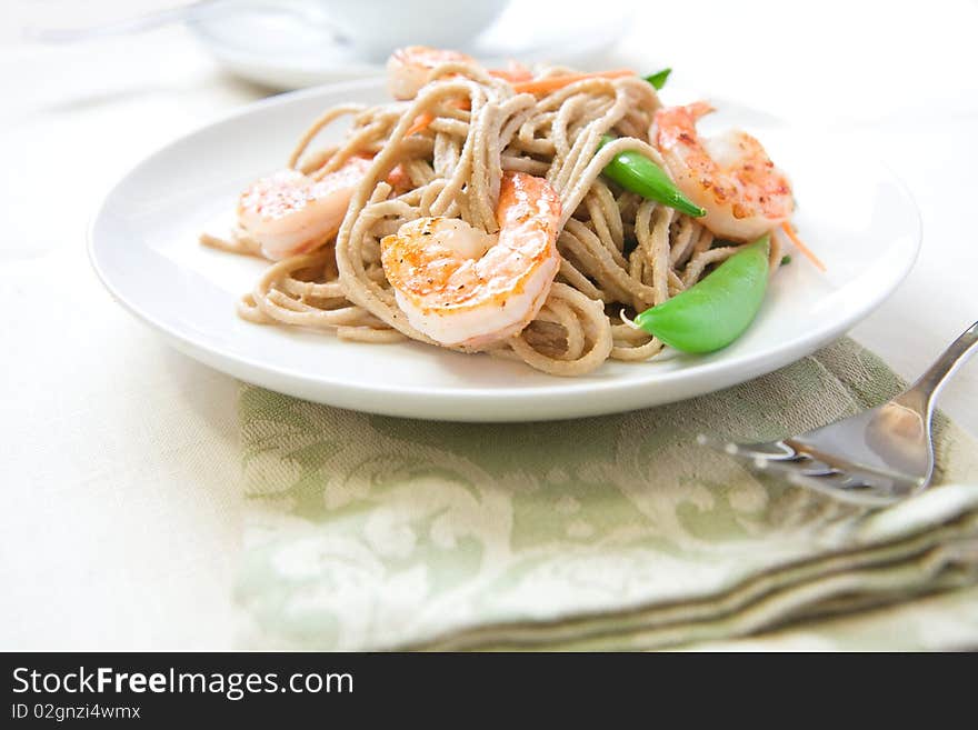 Cold soba noodle salad with shrimp, peas, and carrots