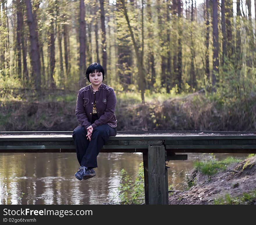 Young woman on the bridge. Young woman on the bridge