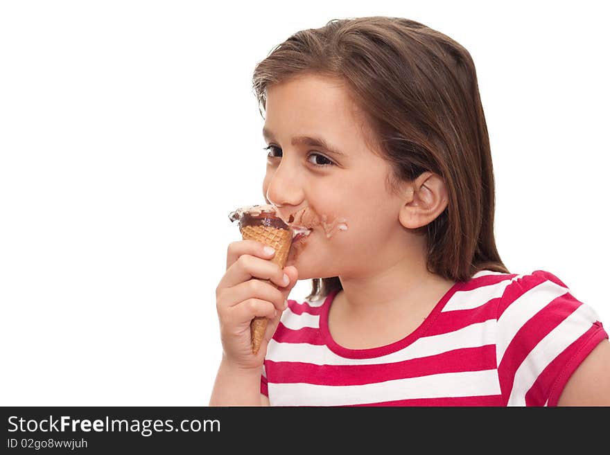 Small girl eating an ice cream cone on a white background