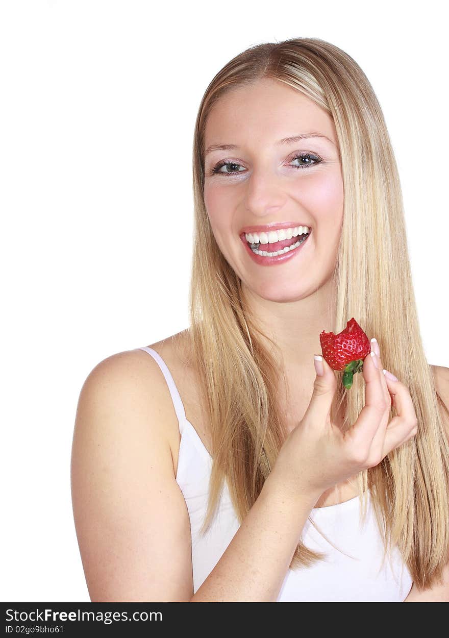 Caucasian blond woman eating strawberry