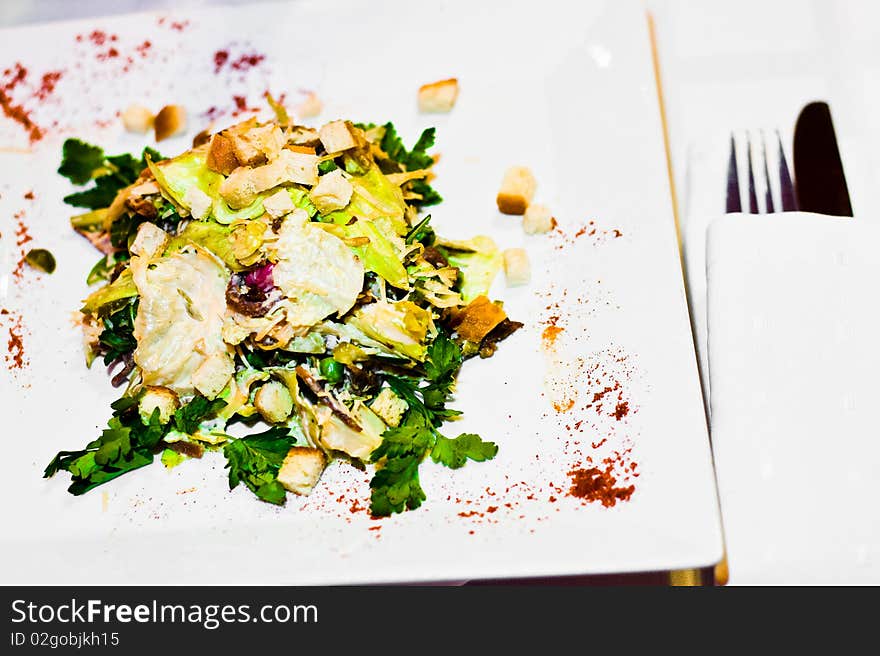 Green salad with meat on a plate