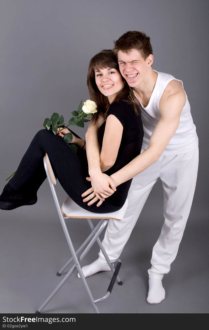 Funny couple laughing in studio