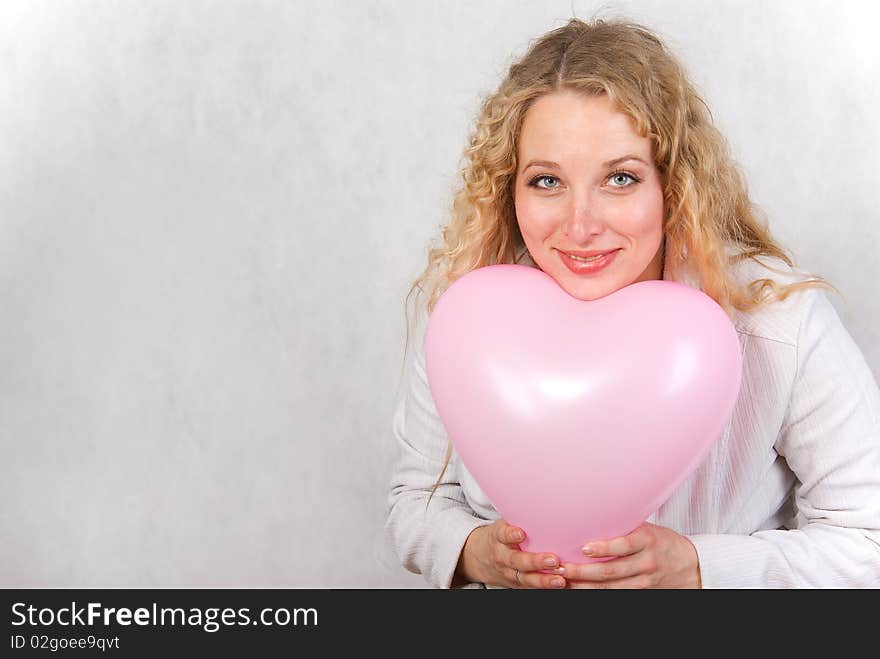 The girl has control over a ball and smiles. The girl has control over a ball and smiles.