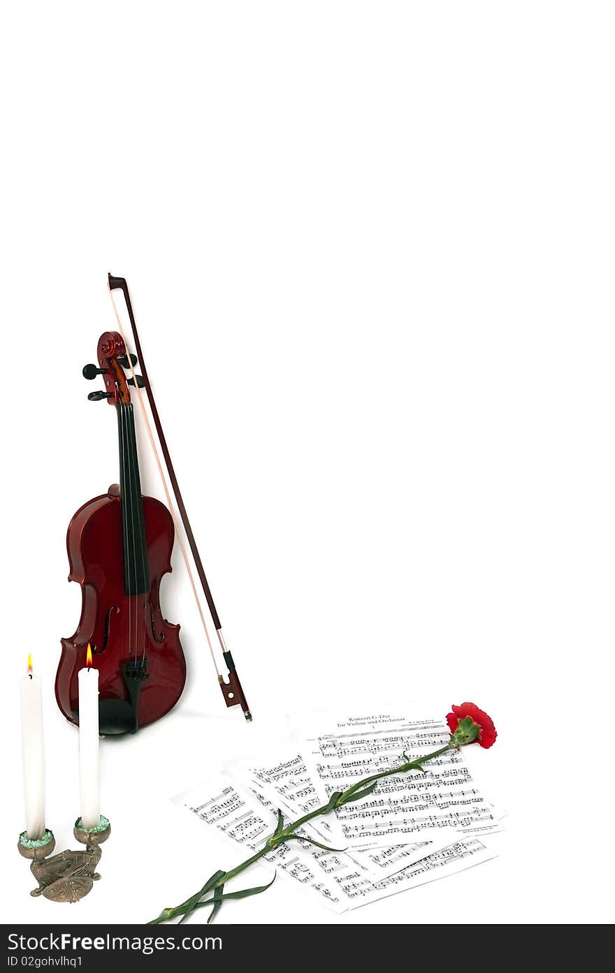 Violin notes with two candles and flower