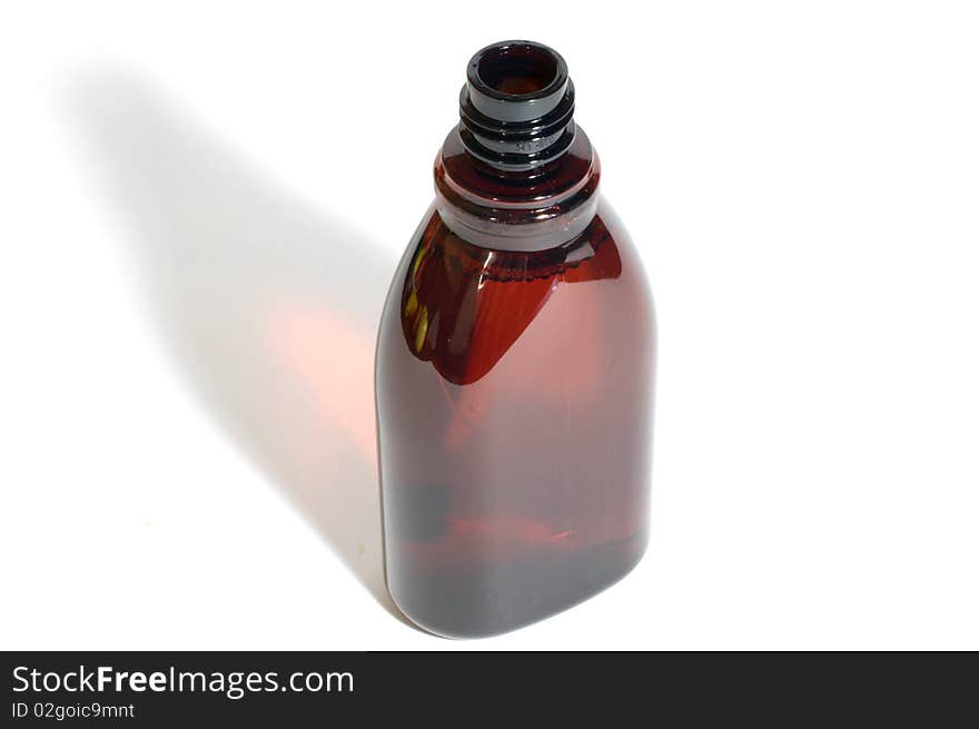 Brown plastic bottle on white background