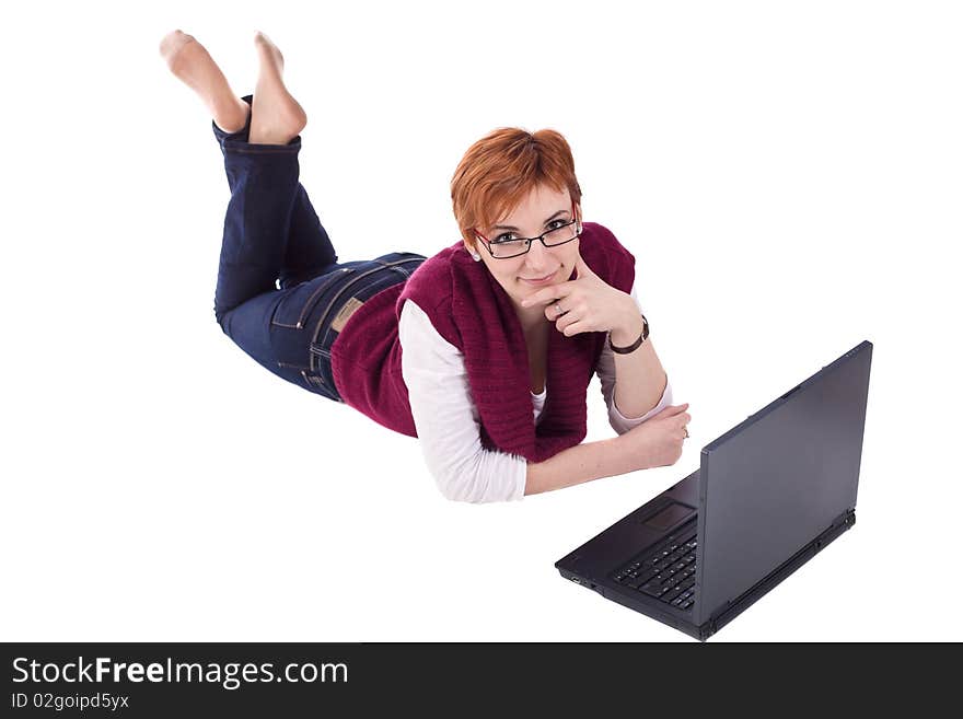 Girl using notebook on the floor isolated on white. Girl using notebook on the floor isolated on white