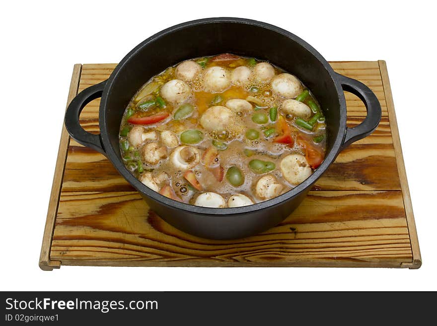 A hearty stew being prepared in a cast-iron pot, isolated on a white background.