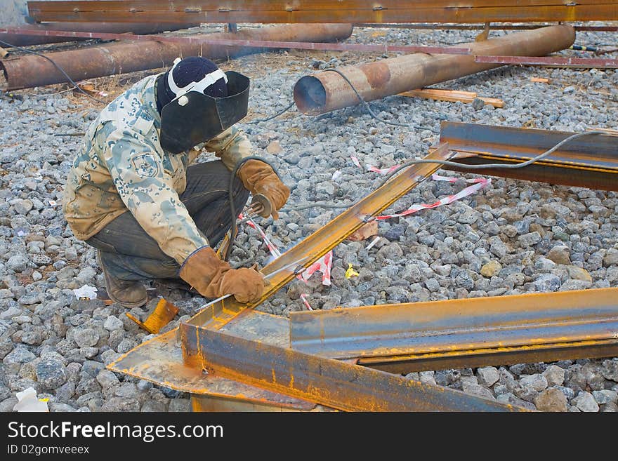 Welder In Mask Welding Construction