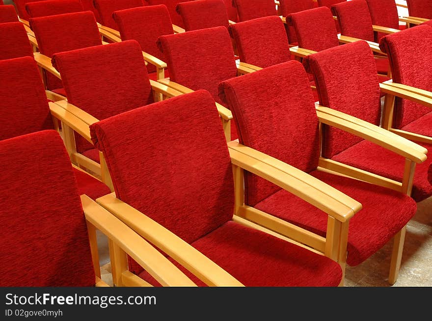 Rows of red chair in auditoriums