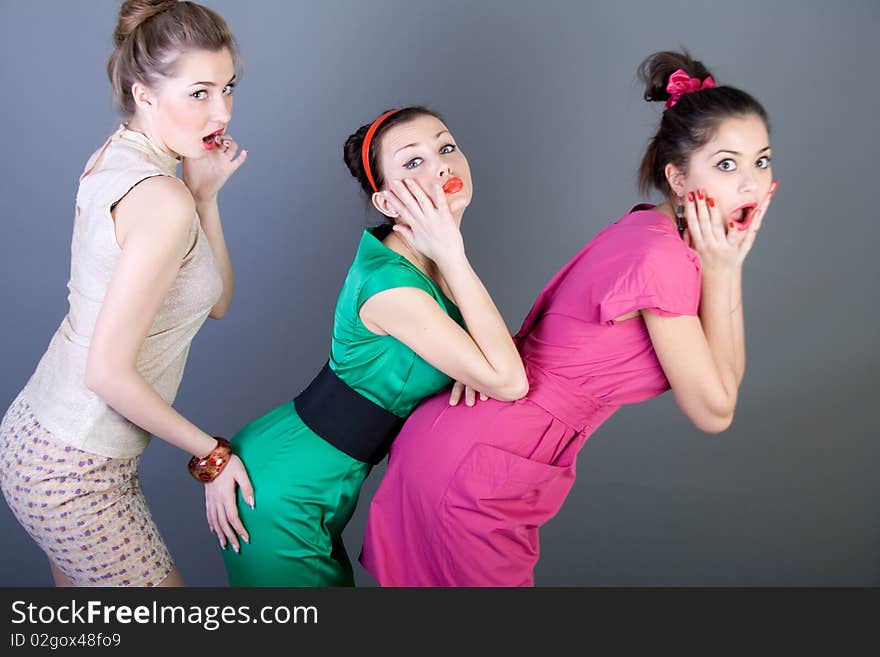 Three happy retro-styled girls in studio