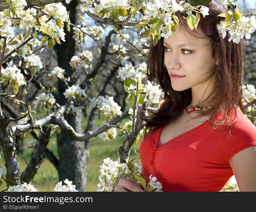 Beautiful young girl resting in spring garden. Beautiful young girl resting in spring garden