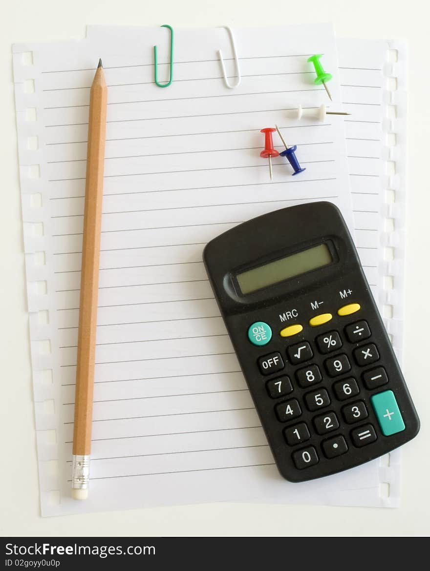 Calculator and pencil, paper clip button on a white background