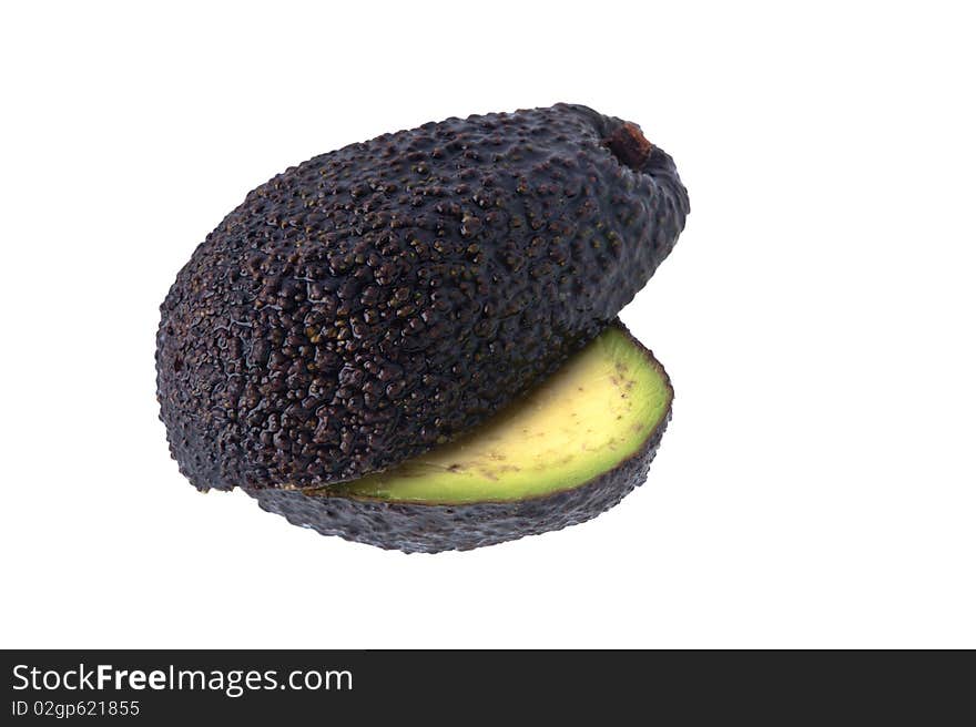 Two half cut avocados against a white background