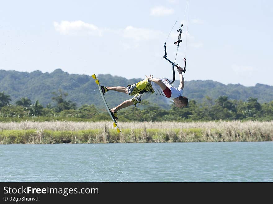 The kiter riding on the river in Dominican Republic. The kiter riding on the river in Dominican Republic