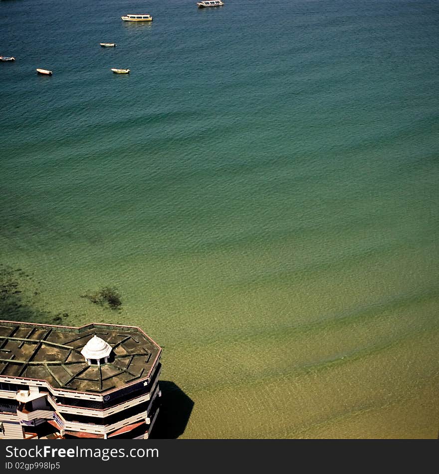 Sea view in square. Boats and bulding in corners.