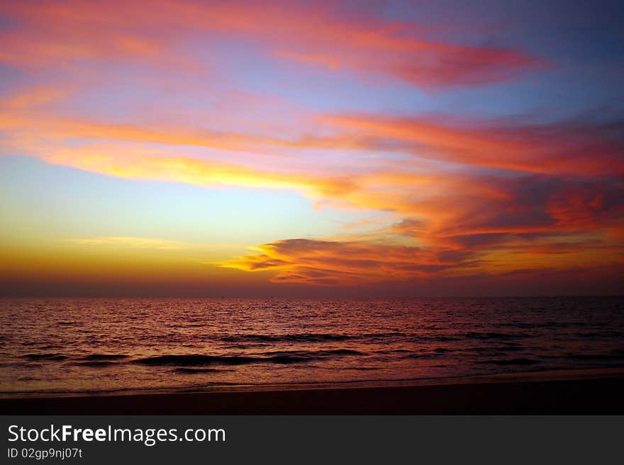 Bright sunset on the seaside. Colorful sky.