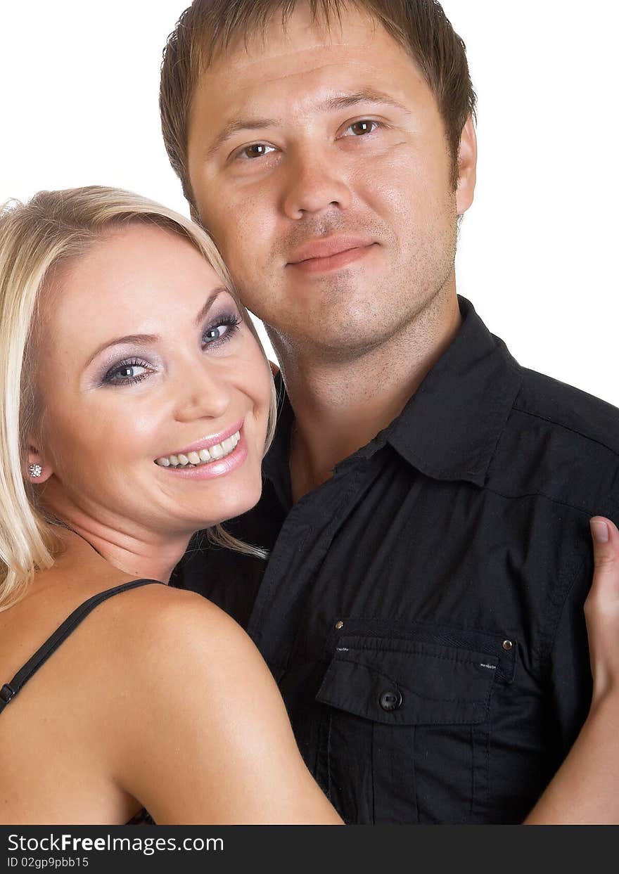 Happy young pair pose on a white background. Happy young pair pose on a white background