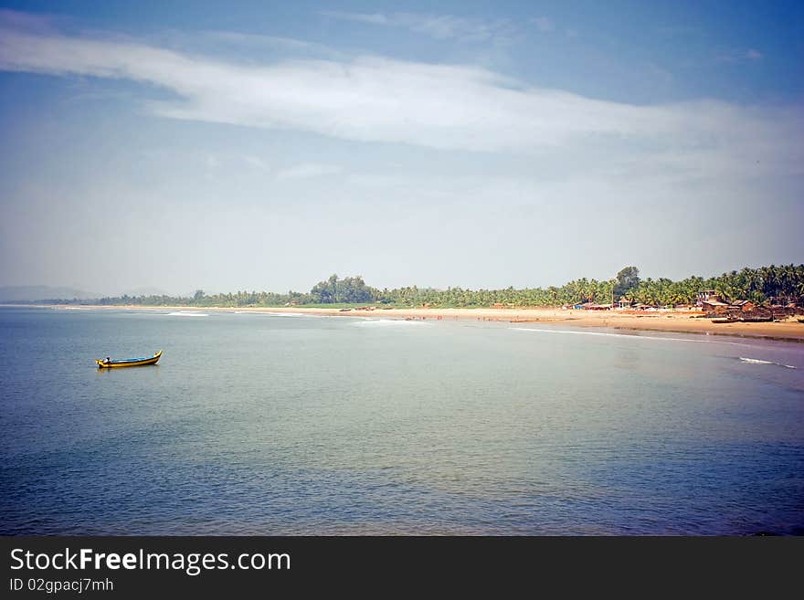 Indian seaside. Boat is coming. View from above. Indian seaside. Boat is coming. View from above.