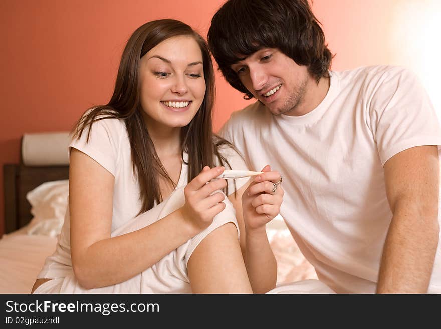 Boy and nice girl with thermometer