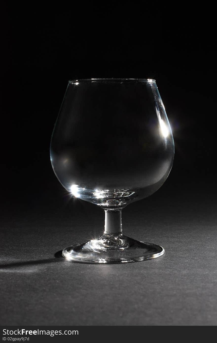 Single glass at dark background. Single glass at dark background