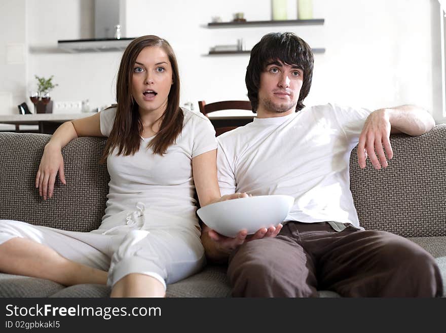 Boy with plate and girl with long hair