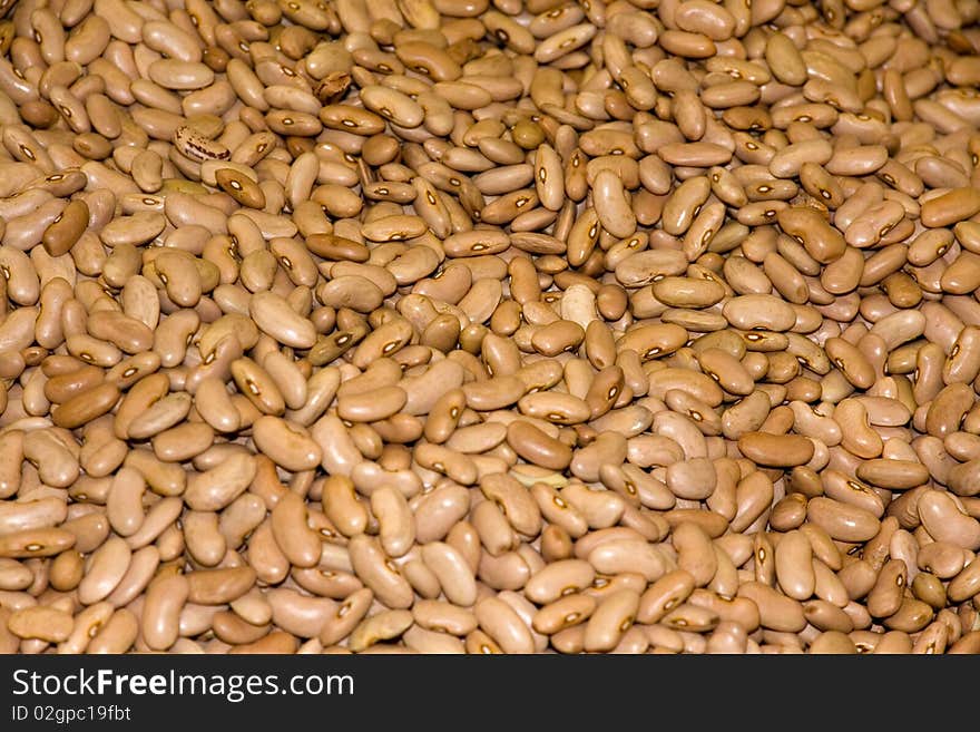 Heap of brown haricots close-up as backgroun