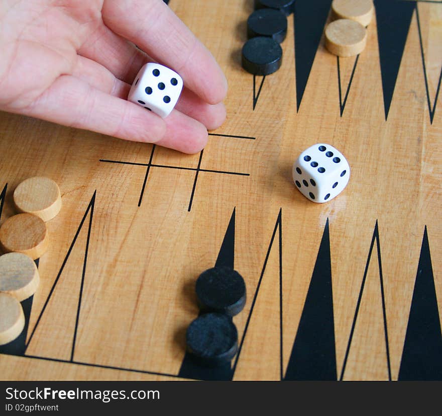 Playing backgammon, rolling the dice