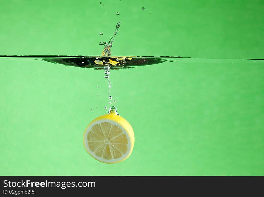 Fresh citrus thrown into the water. Fresh citrus thrown into the water