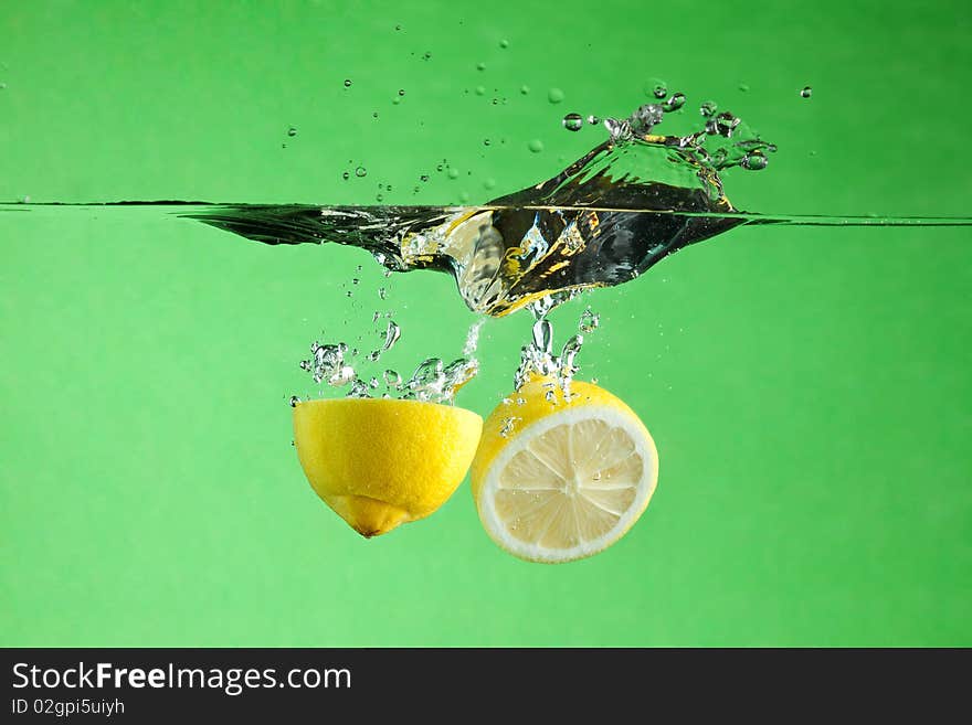 Fresh citrus thrown into the water. Fresh citrus thrown into the water