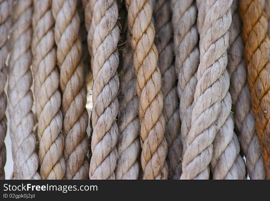 Several old ropes white and yellow. Several old ropes white and yellow