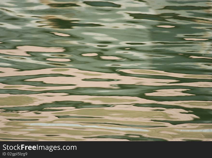 Green and gold still water at the marina. Green and gold still water at the marina