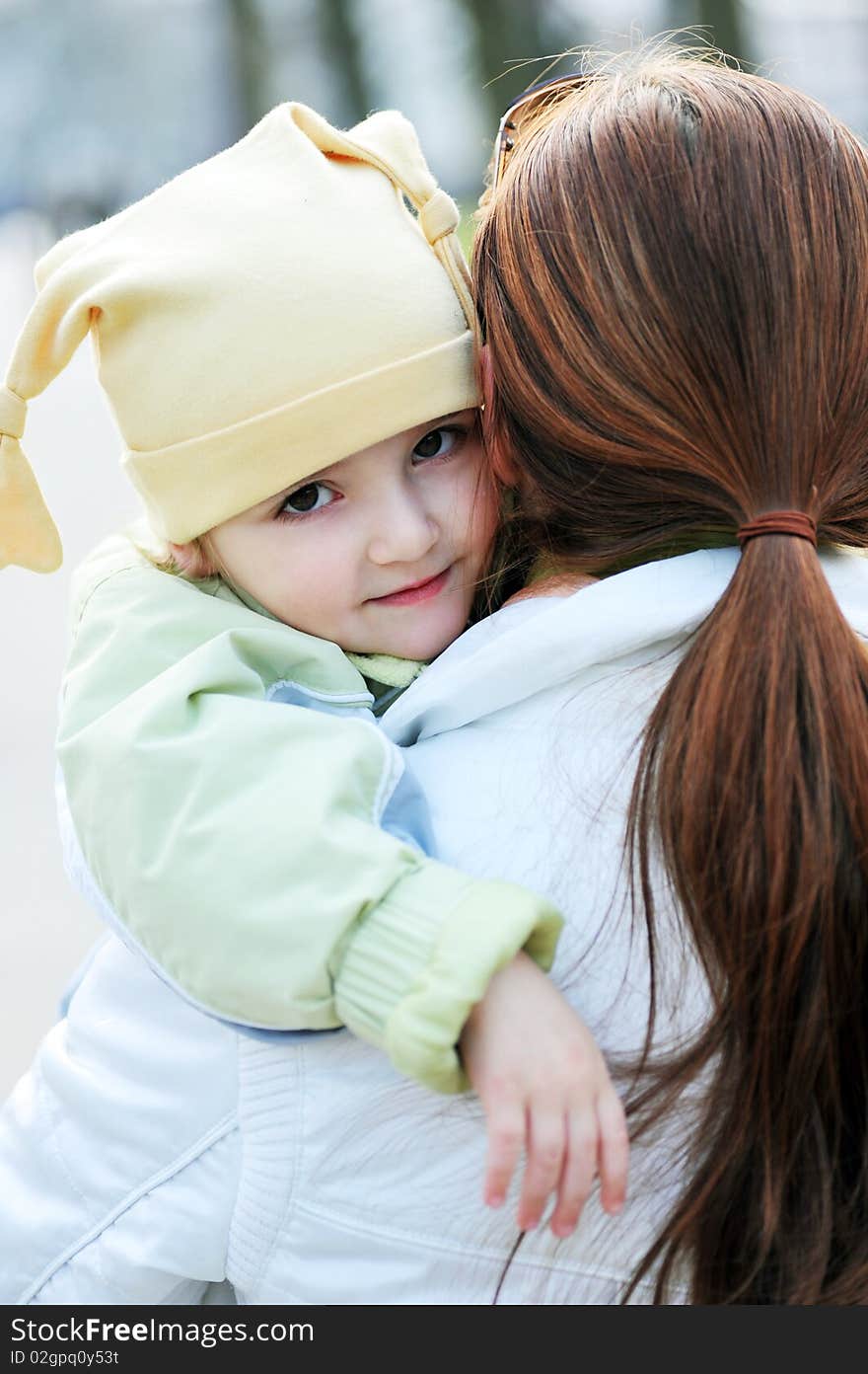 Mother holds  little girl on hands. Mother holds  little girl on hands