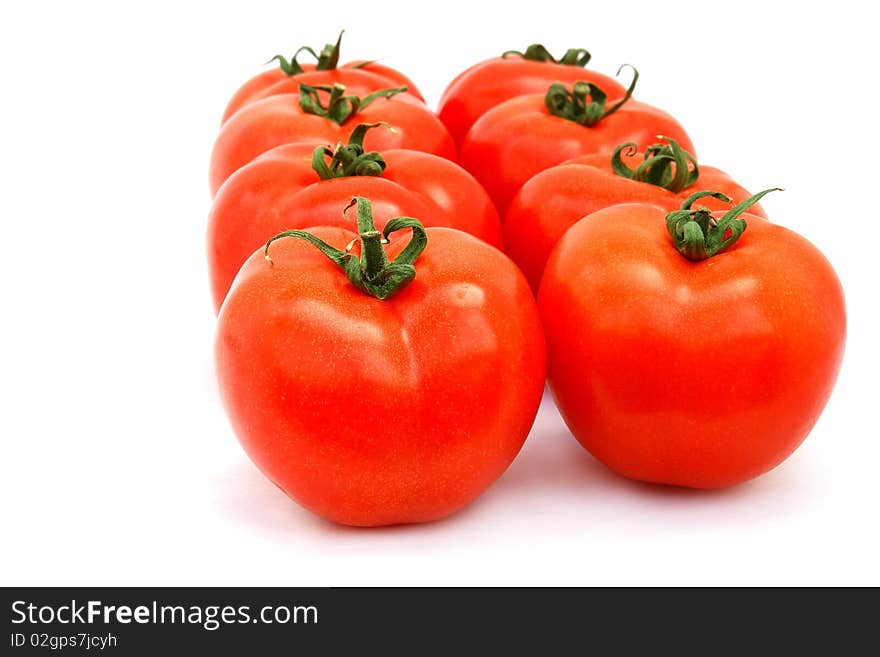 A few red tomatoes isolated on white