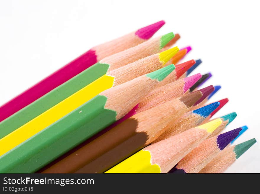 Brunch of colored crayons on white background