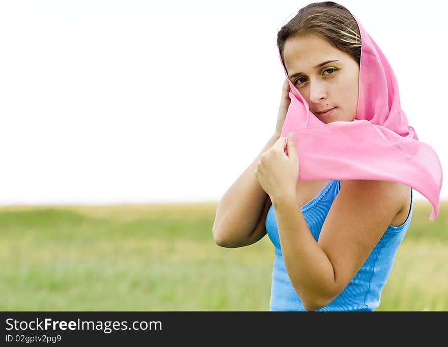 Beautiful young woman in wheat field with scarf. Beautiful young woman in wheat field with scarf