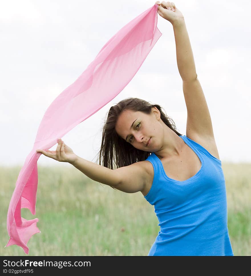 Beautiful young woman in wheat field with scarf. Beautiful young woman in wheat field with scarf