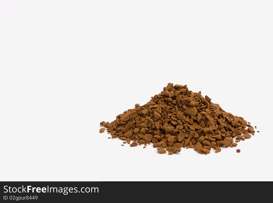 Instant coffee granules on white