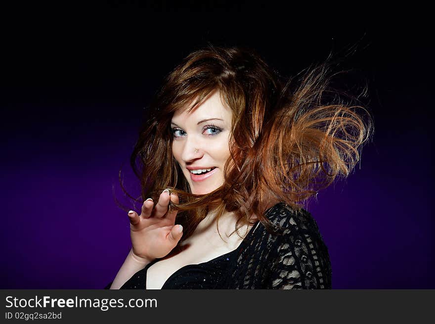 The portrait of a gorgeous lady with red hair