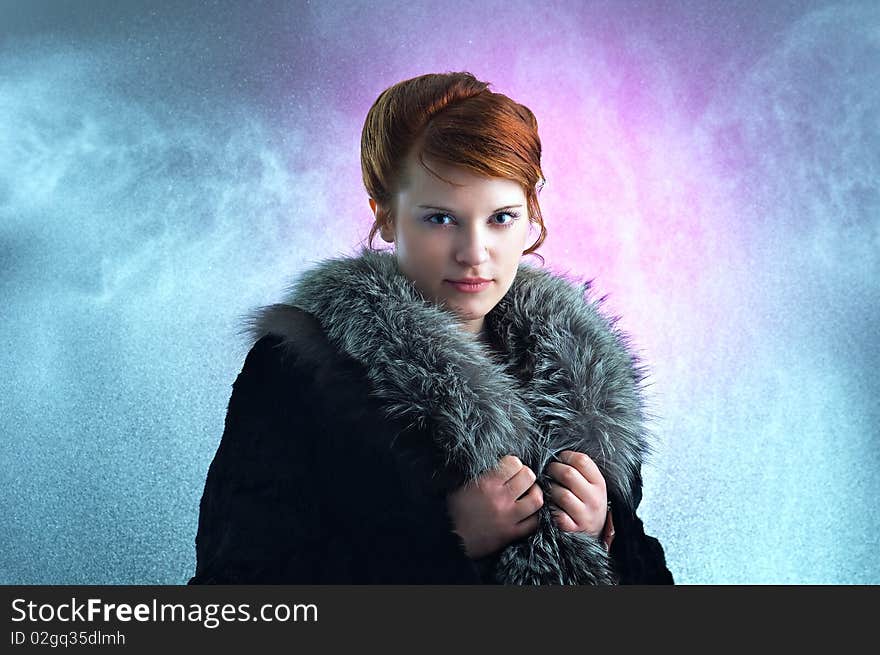 Young ginger lady in a fur coat under the rain. Young ginger lady in a fur coat under the rain