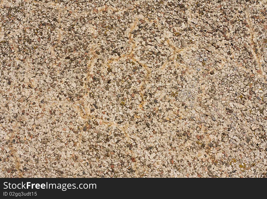 Surface covered with small stones - a picture for a texture or a background. Natural light in a sunny day. Surface covered with small stones - a picture for a texture or a background. Natural light in a sunny day