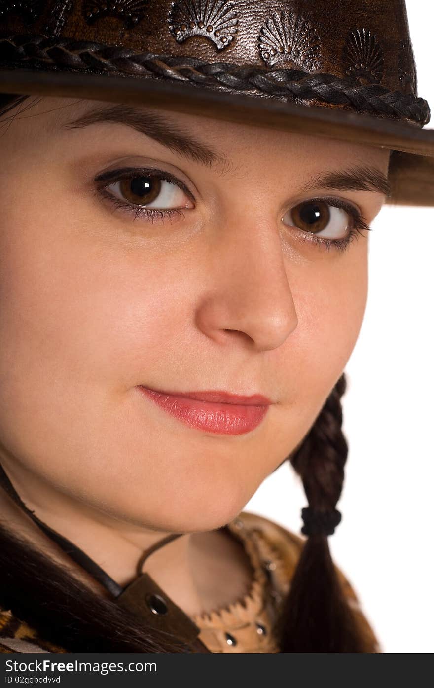 Beautiful young caucasian girl in a cowboy hat over white background. Beautiful young caucasian girl in a cowboy hat over white background